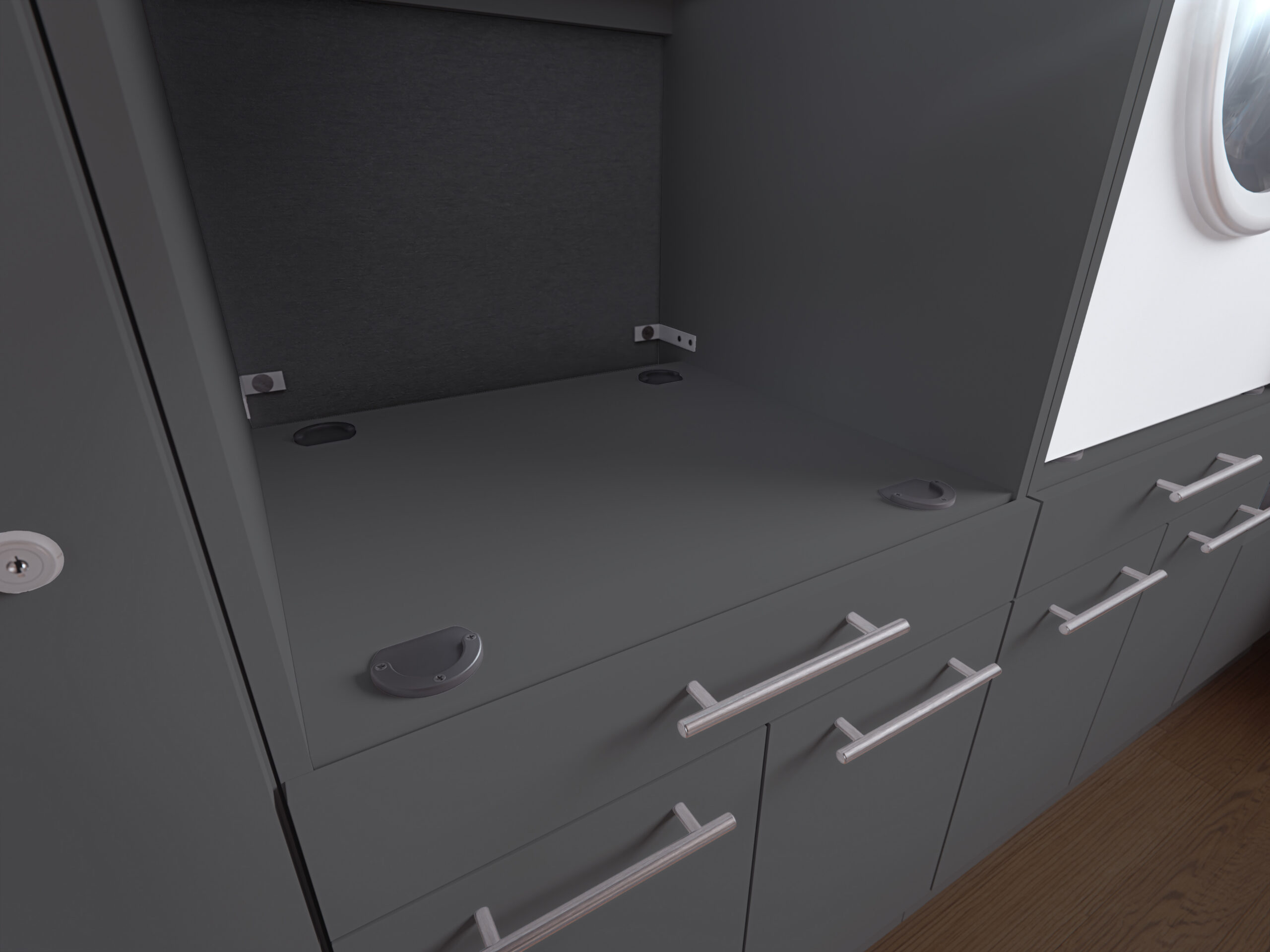 Eine anthrazitfarbene Fläche mit vier dunklen Auflagepunkten befindet sich zwischen zwei Schränken in einem modernen Waschbereich.